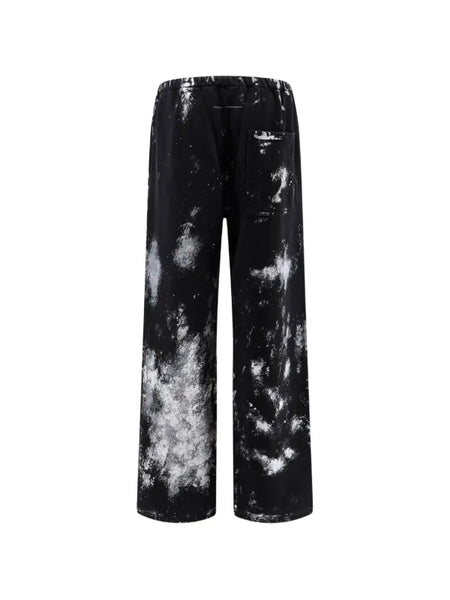 paint-splatter track pants