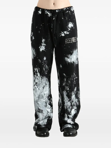 paint-splatter track pants