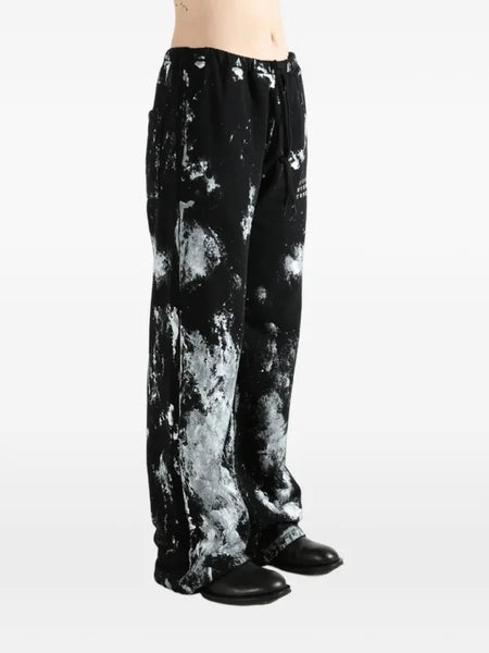 paint-splatter track pants